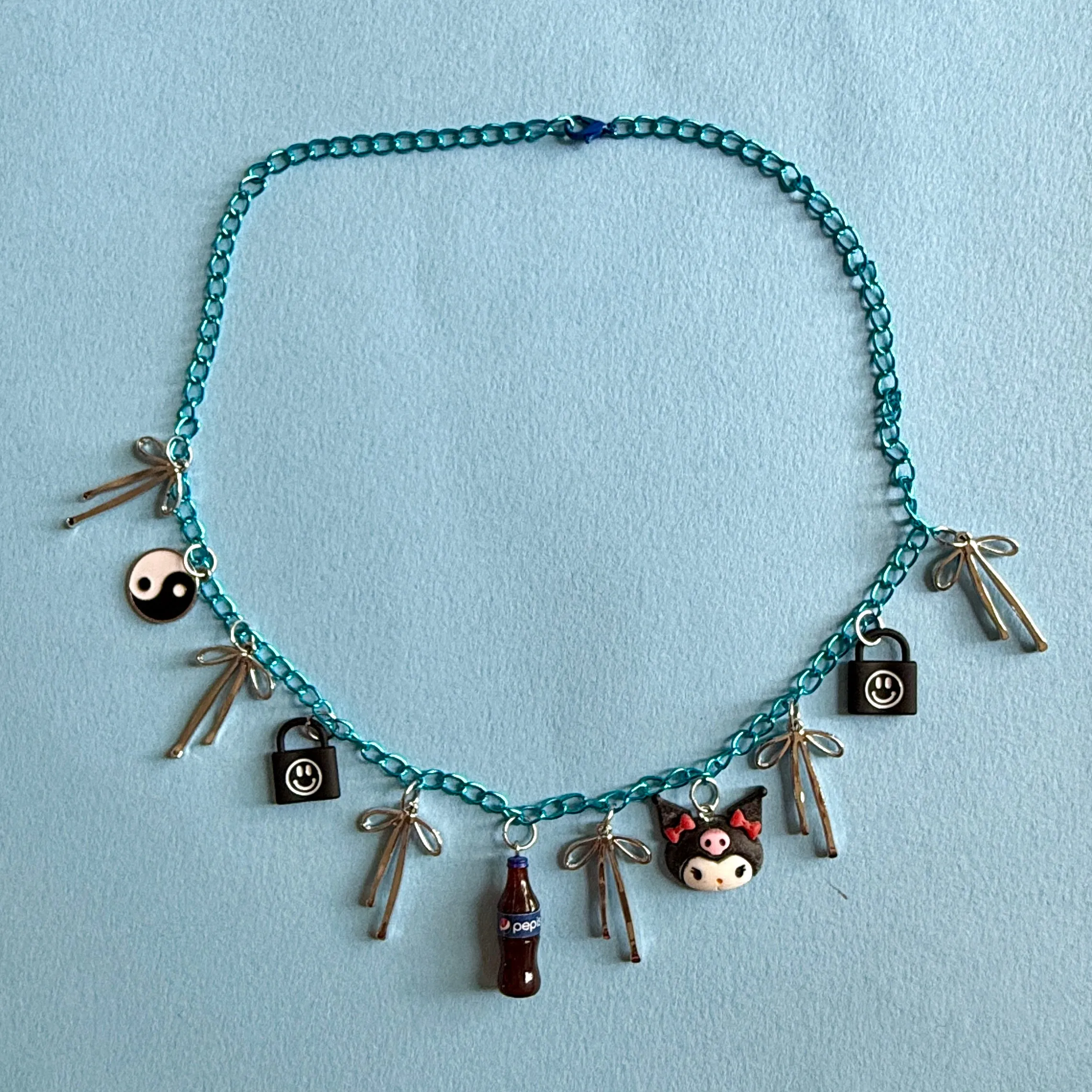 Emo bue charm necklace