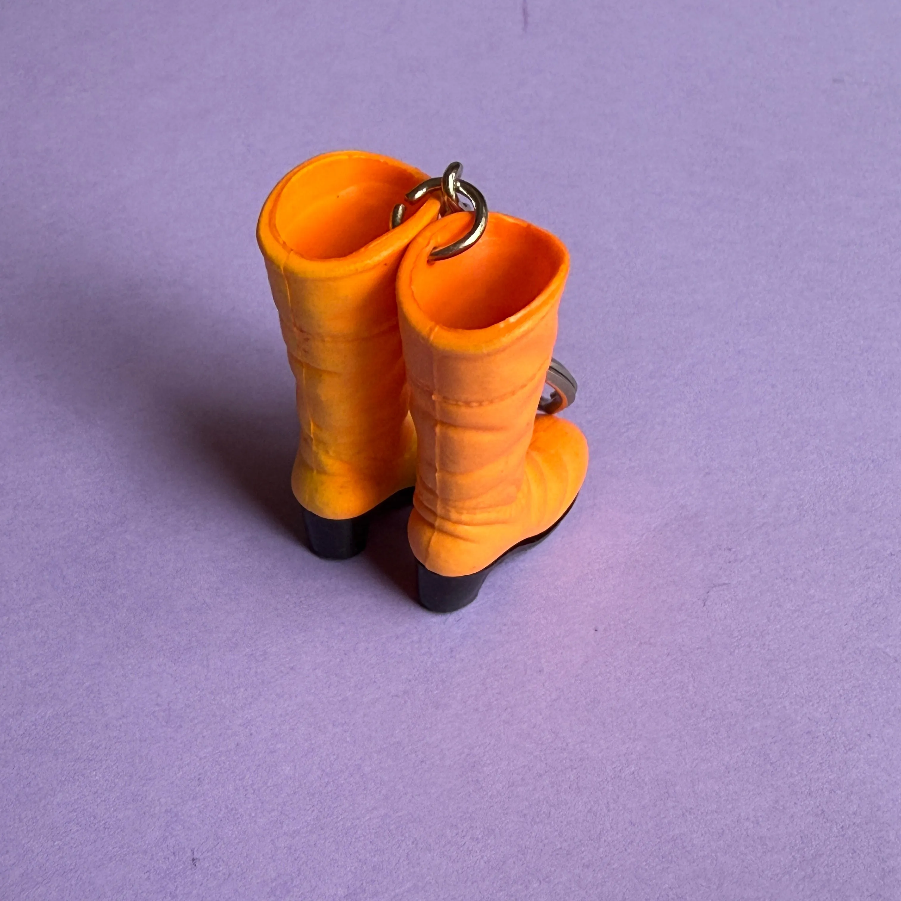 Neon 80s plastic orange boots charm